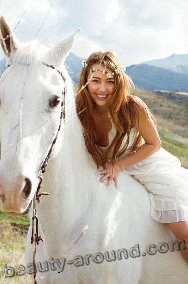 Miley Cyrus with white horse photos